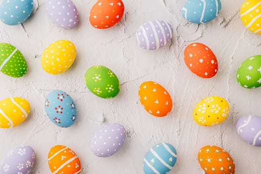 Easter Day Concept. Top view holiday banner background web design white colorful easter eggs painted on white cement background with empty copy space, celebration greeting card, overhead, template