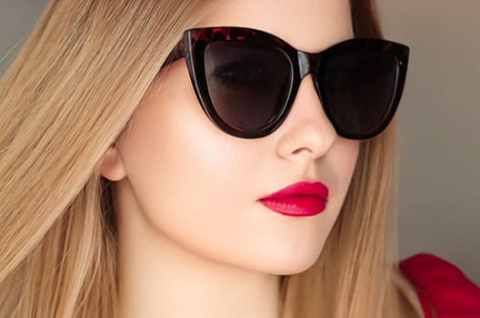 Beauty, fashion and style, face portrait of beautiful woman wearing stylish cat eye sunglasses and red lipstick make-up, luxury accessory and summer lifestyle, glamour and chic look.