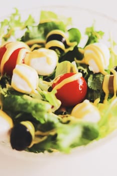 Food and diet, salad with fresh vegetables and mozzarella cheese as meal for lunch or dinner, tasty recipe idea