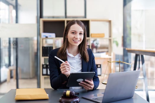 Business Lawyer consulting online on laptop while working at office..