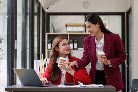 Fund managers team consultation and discuss about analysis Investment stock market by laptop computer.