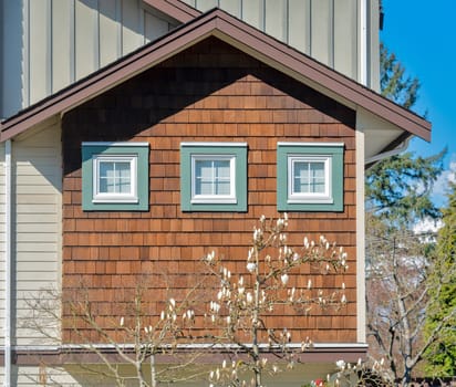 Fragment of residential townhouse on a bright spring day.