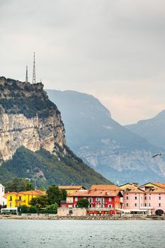 Beautiful lake Lago di Garda and the village of Torbole, Alpine scenery. Italy.