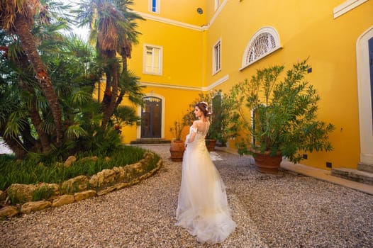 Stylish young bride on her wedding day in Italy.elegant Bride from Tuscany.Bride in a white wedding dress.