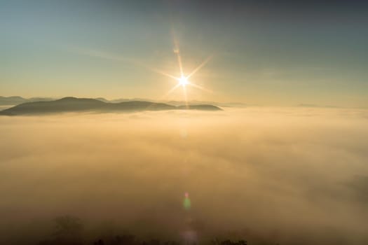 Morning fog covers Lamphun, Thailand, view from the viewpoint of Wat Phra That Pha Temple
