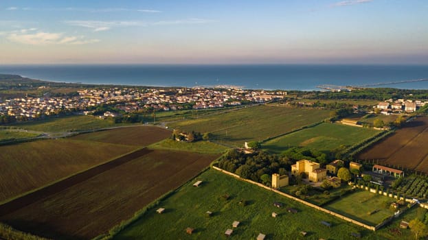 Top view of the old yellow villa in the Tuscan region and the fields.Italy.