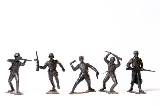 Vintage toy black soldiers isolated on white background.