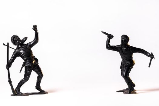 Vintage toy black soldiers isolated on white background.