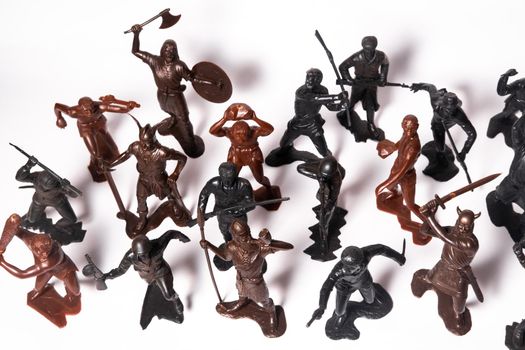 A set of different toy figures of soldiers on a white background.