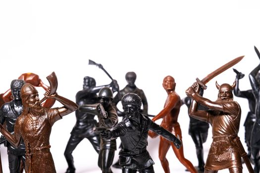 A set of different toy figures of soldiers on a white background.