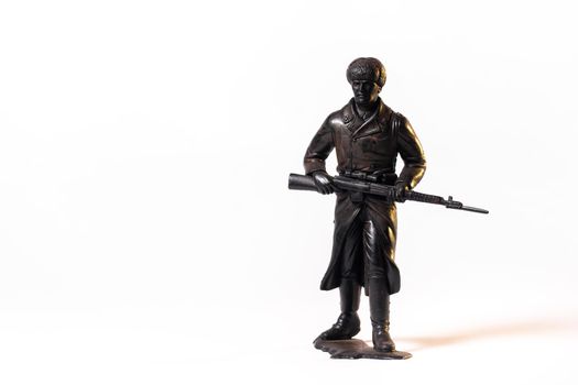 Vintage toy black soldier isolated on white background.