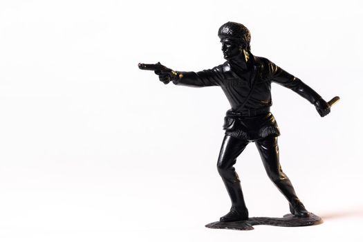 Vintage toy black soldier isolated on white background.