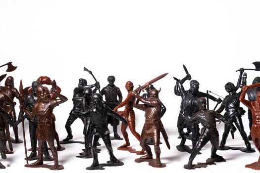 A set of different toy figures of soldiers on a white background.