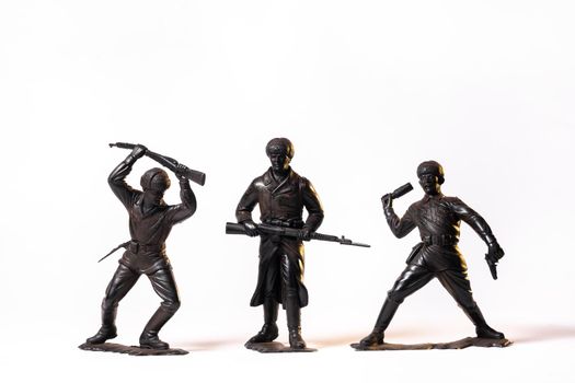 Vintage toy black soldiers isolated on white background.