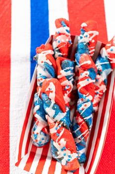 Patriotic cinnamon twists drizzled with a white glaze and decorated with star sprinkles.