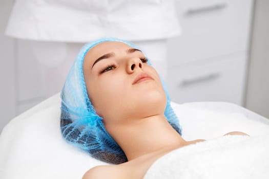 young beautiful woman at spa salon. female face with healthy smooth soft skin