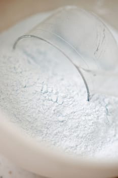 white powder for cosmetic and glass jar, close-up