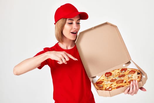 pizza delivery girl pointing finger to pizza isolated on white background