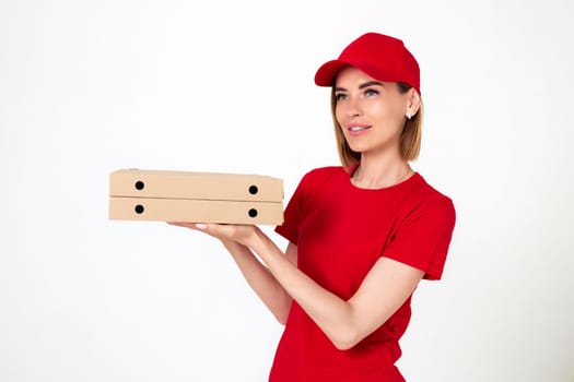 pizza delivery woman in uniform holding pizza boxes on white background