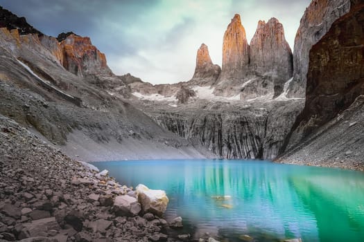 Torres Del Paine granites at dramatic sunrise and lake reflection, Chilean Patagonia landscape