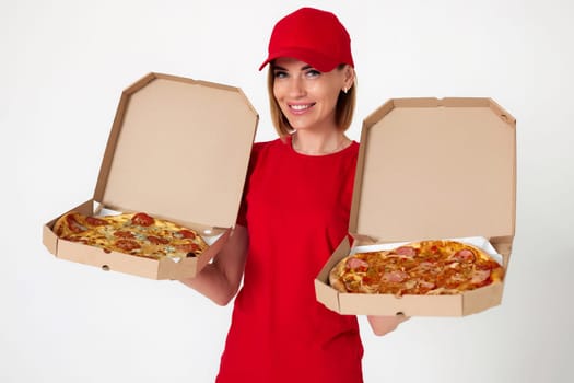 pizza delivery girl showing showing opened boxes with delicious pizza on white background
