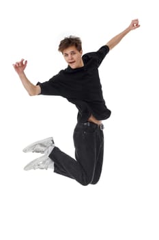 Cheerful young man in black t-shirt jumping high isolated on white background
