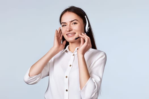woman with headphones and microphone is consulting clients online. Call center, business people concept