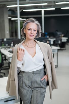 Portrait of an attractive mature caucasian woman in the office