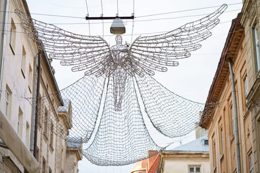 street lighting in the form of an angel flying over the city