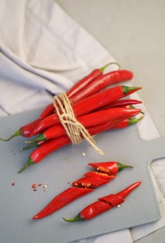Grey background with chili pepper. Red, hot. Capsicum. Seasoning Spice Mexican