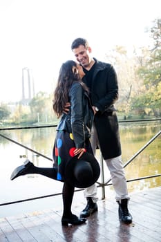 Beautiful in love couple walking in autumn park