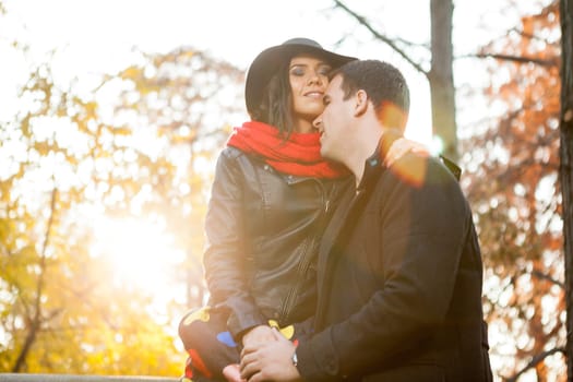 Beautiful gourgeous young couple in autumn park