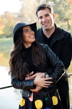 Happy in love couple walking in autumn park