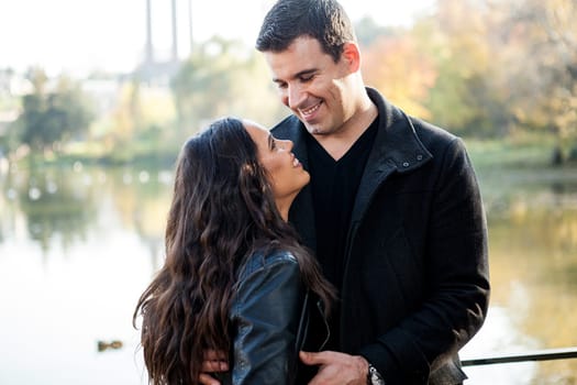 Happy in love couple walking in autumn park