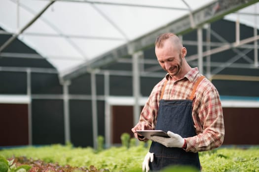 Farmer checking quality by tablet agriculture modern technology. Concept using modern technologies in agriculture