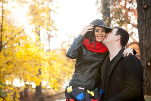 Beautiful gourgeous young couple in autumn park