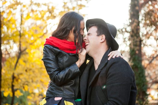 Beautiful in love happy couple in autumn park having fun