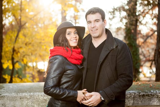 Beautiful gourgeous couple in autumn park having good time