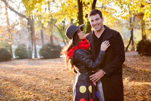 Young happy couple in park having fun