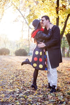 Young happy couple in park having fun