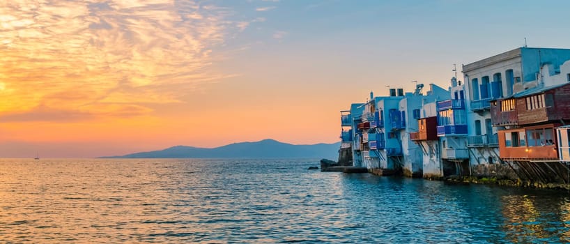 sunset at Mykonos Greek village in Greece, colorful streets of Mikonos village.