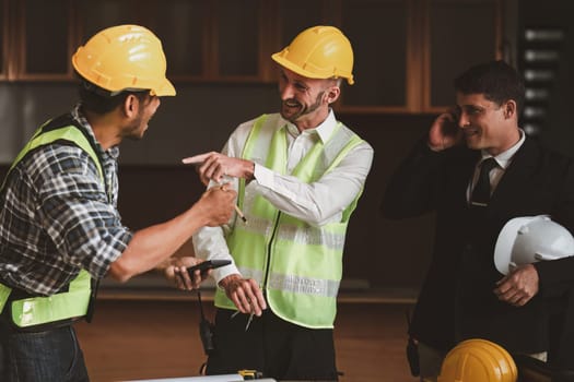 Civil Engineer team helmets hardhat on construction site and working together. Foreman industry project manager engineer teamwork. industry professional team.