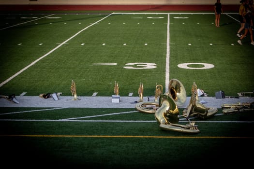 High school sousaphone insturments up close on foot ball field . High quality photo