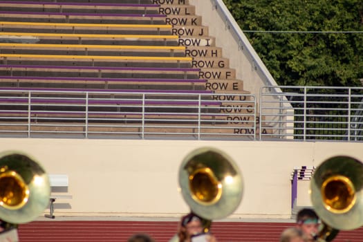 High school sousaphone players up close on foot ball field . High quality photo