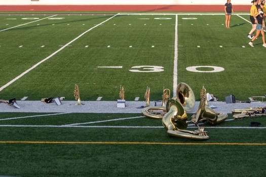 High school band instruments up close on foot ball field 30 yard line. High quality photo