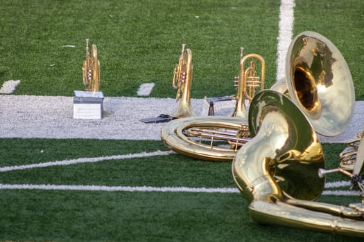 High School Band Instruments set on football field ready to play . High quality photo