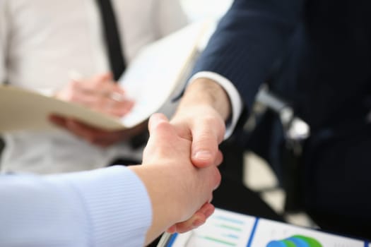 Two business people shake hands after business interview in conference room in office. Congratulation investor success and interview concept