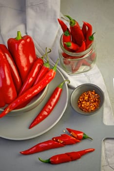 Grey background with chili pepper. Red, hot. Capsicum. Seasoning Spice Mexican