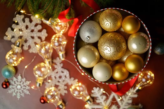 Merry Christmas gift box on red decorated festive background, top view