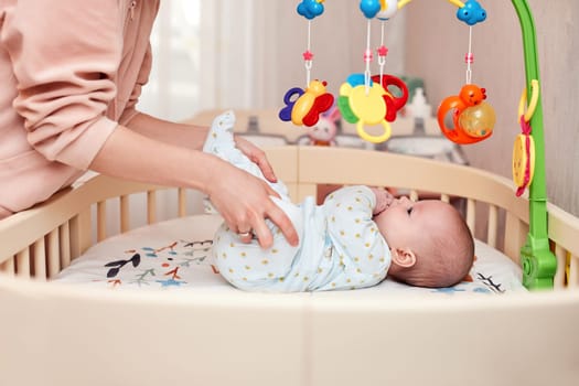 Baby massage. mom doing exercises with baby for development.